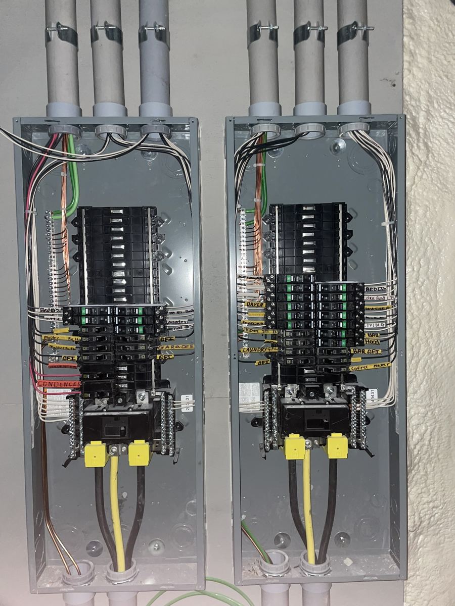 Open breaker panels with circuits traced and labelled